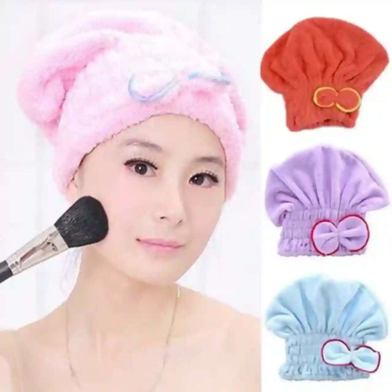 Woman applying makeup with a brush, wearing a pink towel on her head, and surrounded by colorful towel hats.
