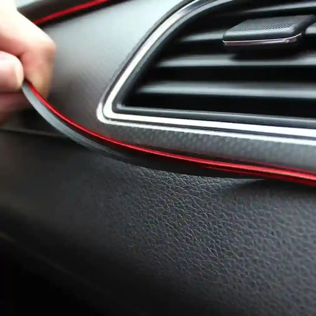 Car interior with a hand adjusting the air vent.