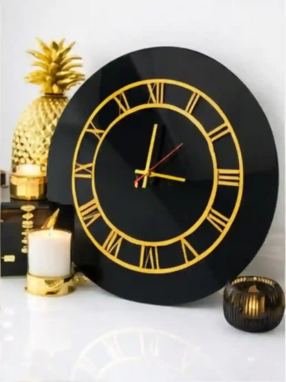 Black wall clock with gold Roman numerals on a decorative background