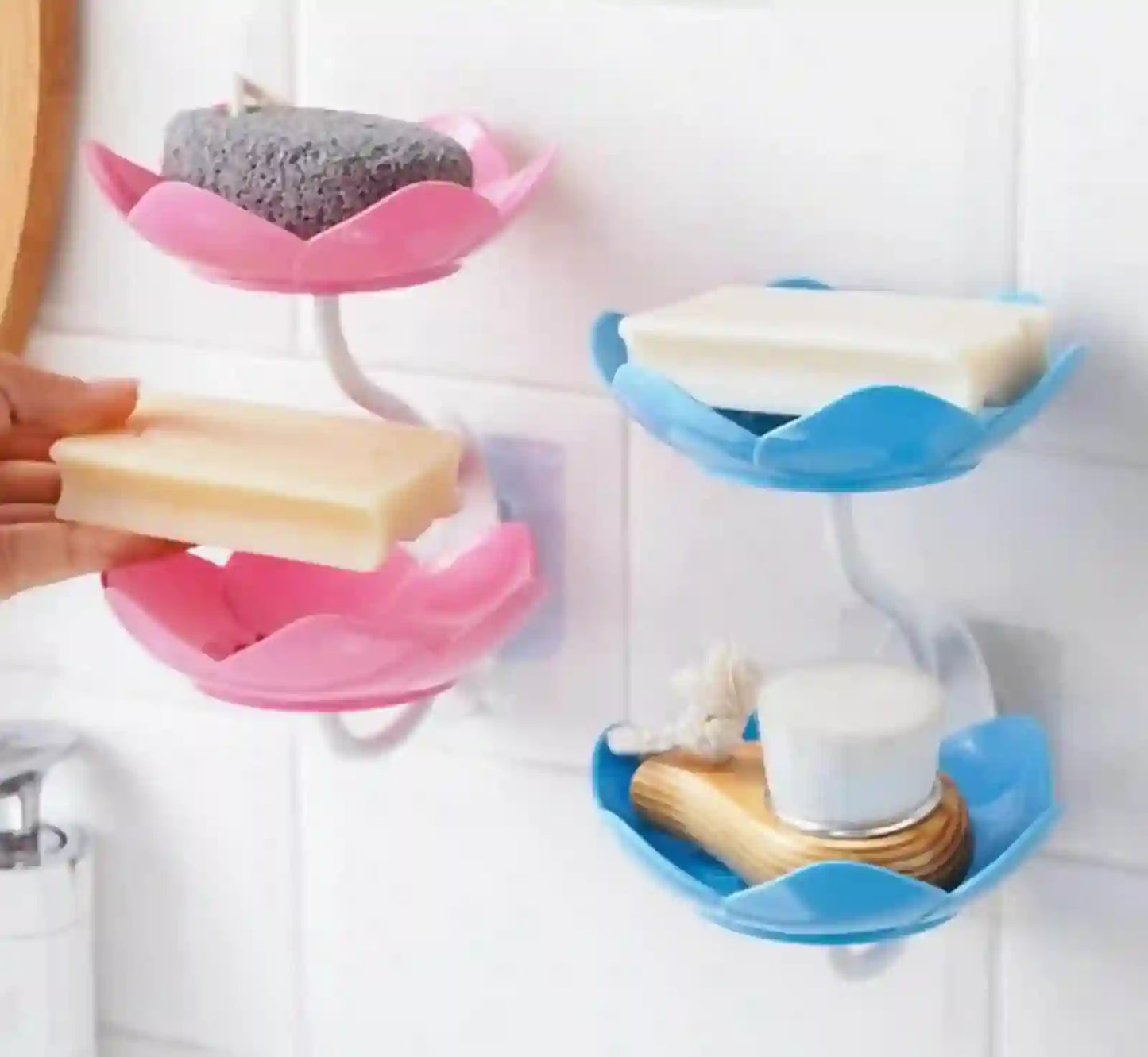 Bathroom organizer with pink and blue holders holding various items.