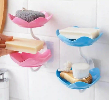 Bathroom organizer with pink and blue holders holding various items.