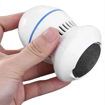 Hand holding a white electronic device with a black scrubber on a white background