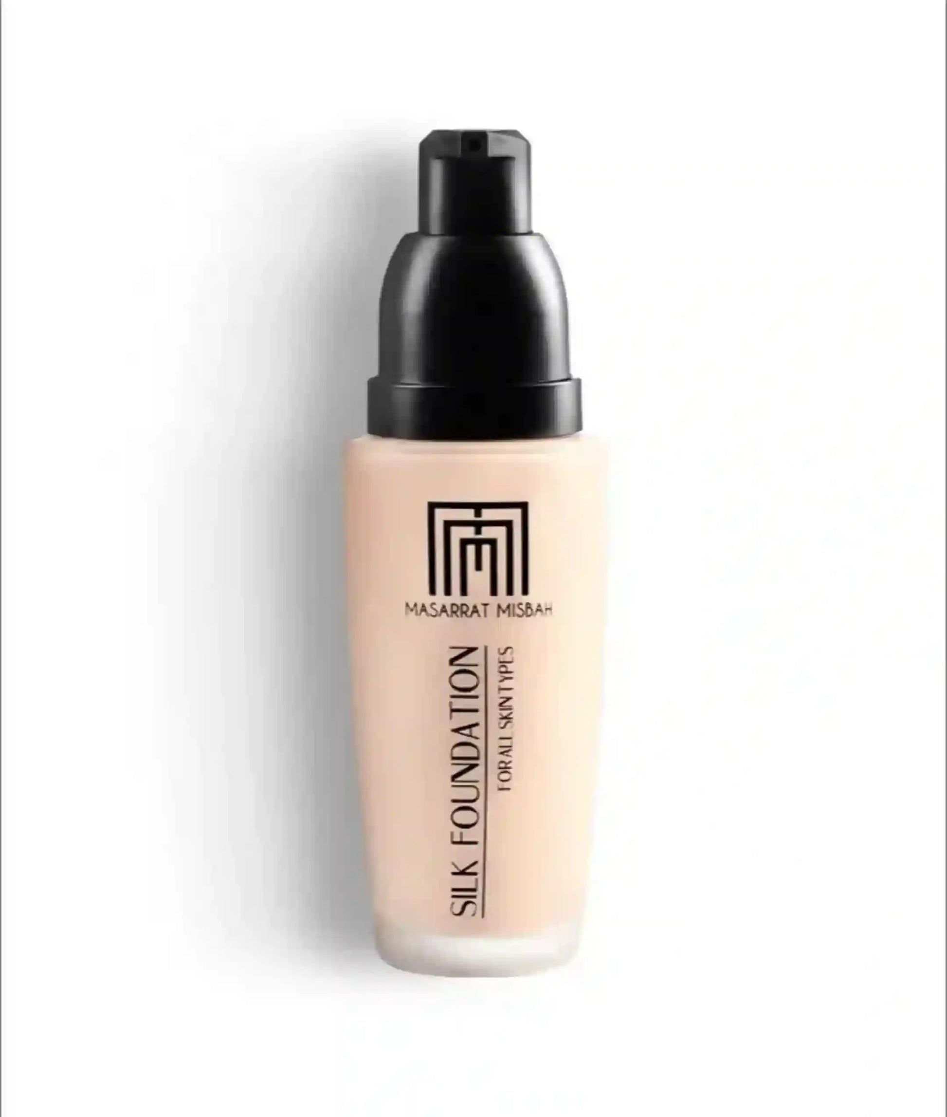 Foundation bottle with black cap on a white background