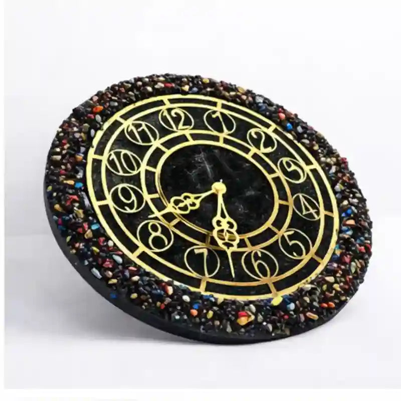 Decorative clock with gold hands and multicolored stone border on a white background