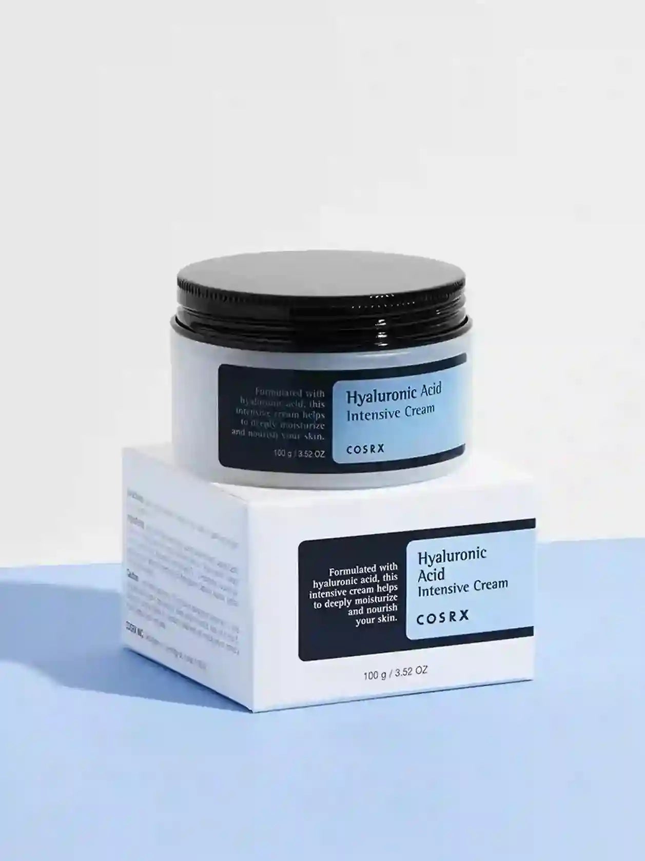 CosRX Hyaluronic Acid Intensive Cream jar and box on a light blue background