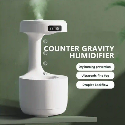 Counter gravity humidifier with digital display on a green background