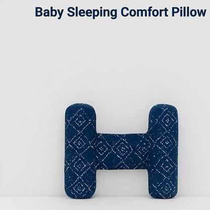 Blue baby sleeping comfort pillow with diamond pattern on a white background