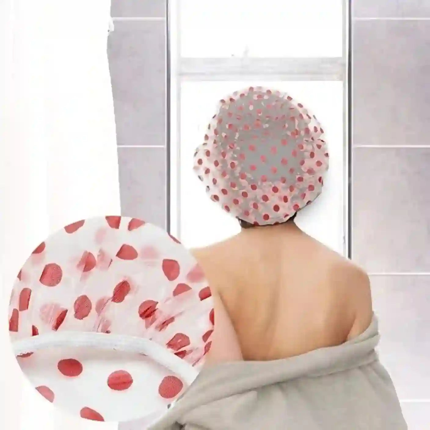 Person wearing a polka dot shower cap with a towel draped over their shoulders in a bathroom setting.