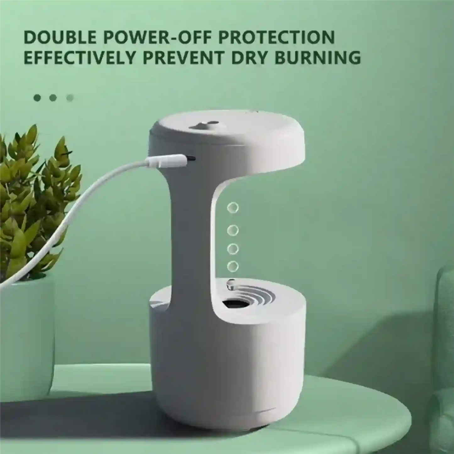 White electronic device with a cable on a green surface, featuring text about power-off protection.