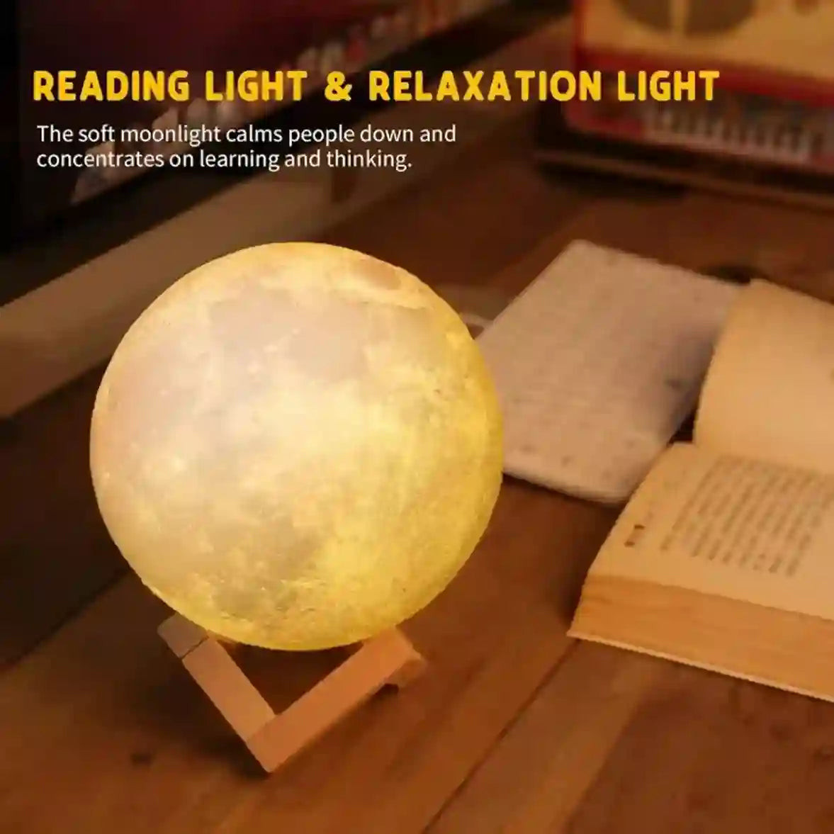 Moon lamp on a wooden surface with books, labeled for reading and relaxation.