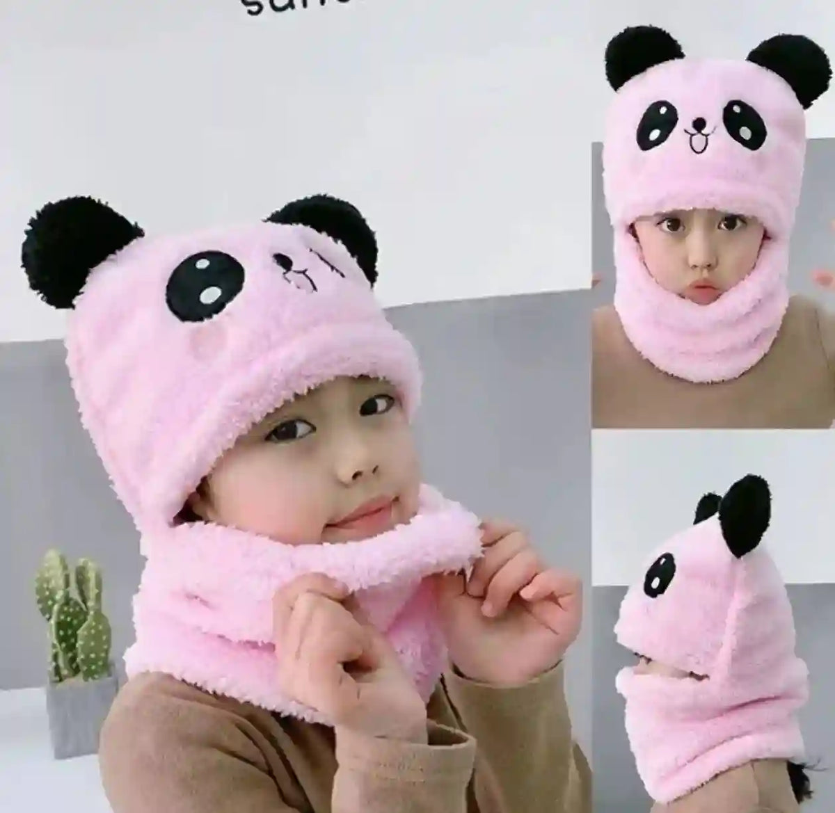 Child wearing a pink panda hat and scarf with a white background