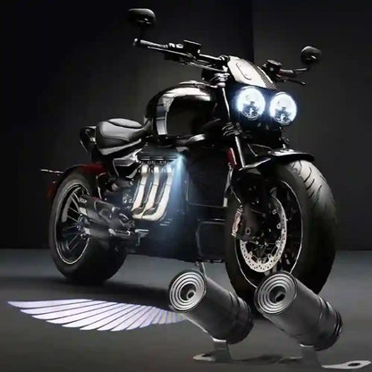 Motorcycle with illuminated headlights on a dark background