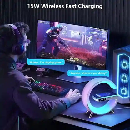 Person playing a game on a computer with 15W wireless fast charging feature highlighted.