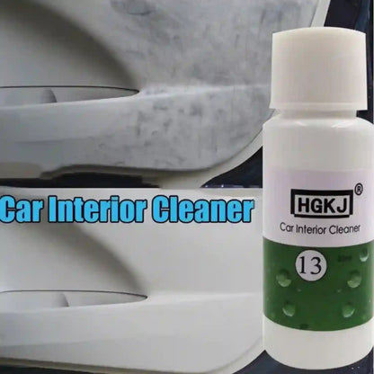 Car interior cleaner bottle with visible brand name on a car interior background
