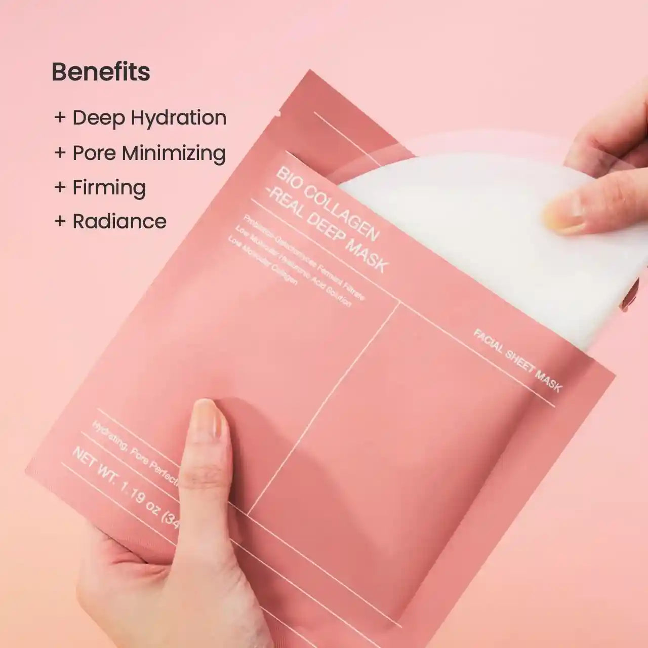 Facial sheet mask with pink packaging and a hand holding it, on a pink background.