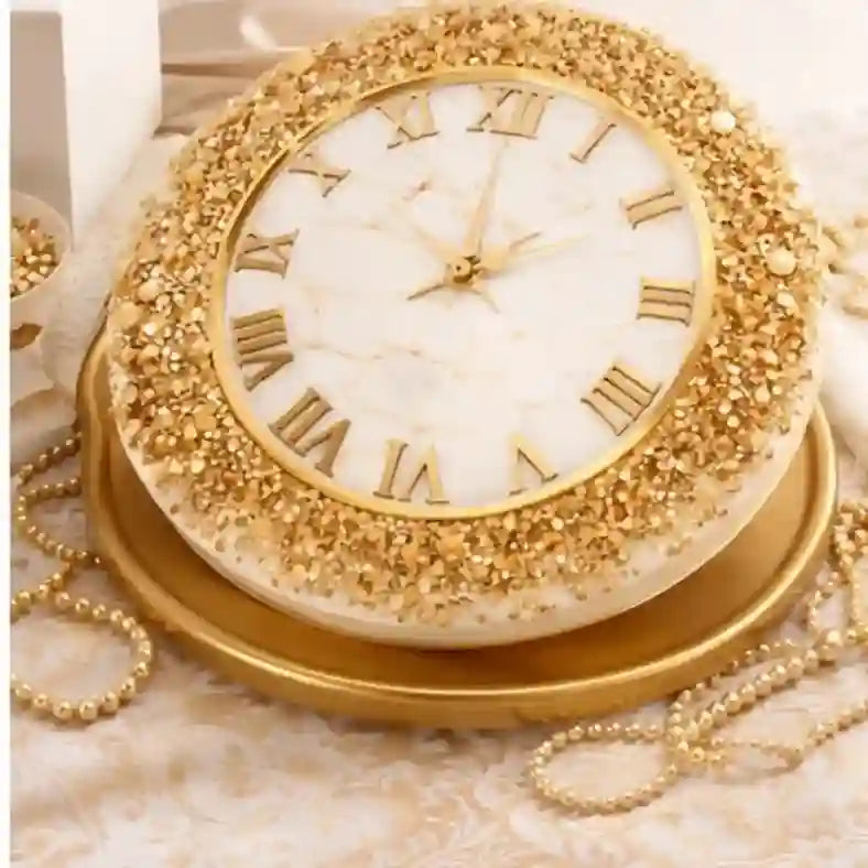 Decorative clock with gold embellishments on a textured surface