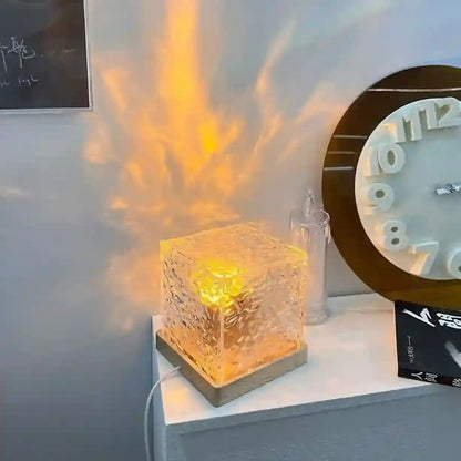 Decorative lamp with flame effect on a surface next to a clock.