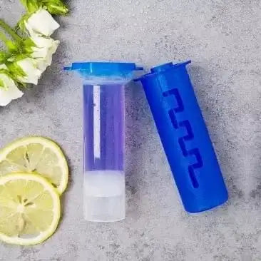 Blue and clear plastic drink mixer with lemon slices on a gray surface