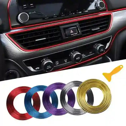 Car interior dashboard with decorative trim strips in various colors.