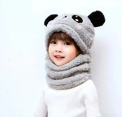 Child wearing a gray panda hat and scarf on a white background