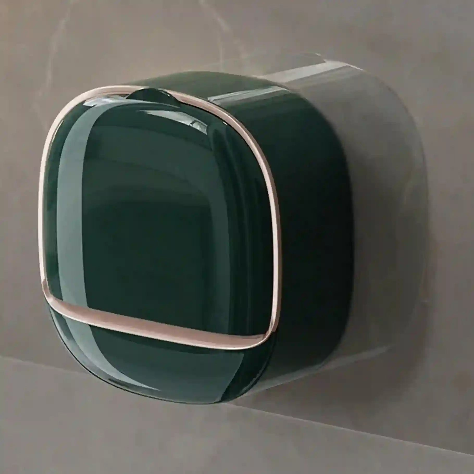 Green square object with metallic rim on a gray background