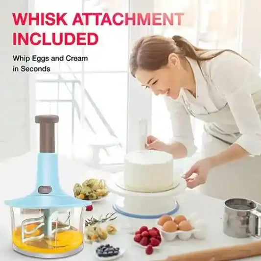 Person using a kitchen appliance with a whisk attachment included, surrounded by fruits and eggs.