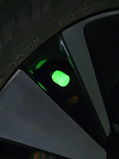 Close-up of a computer case with green LED lights on a dark background