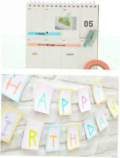 Calendar with decorative elements and a 'Happy Birthday' banner on a white background