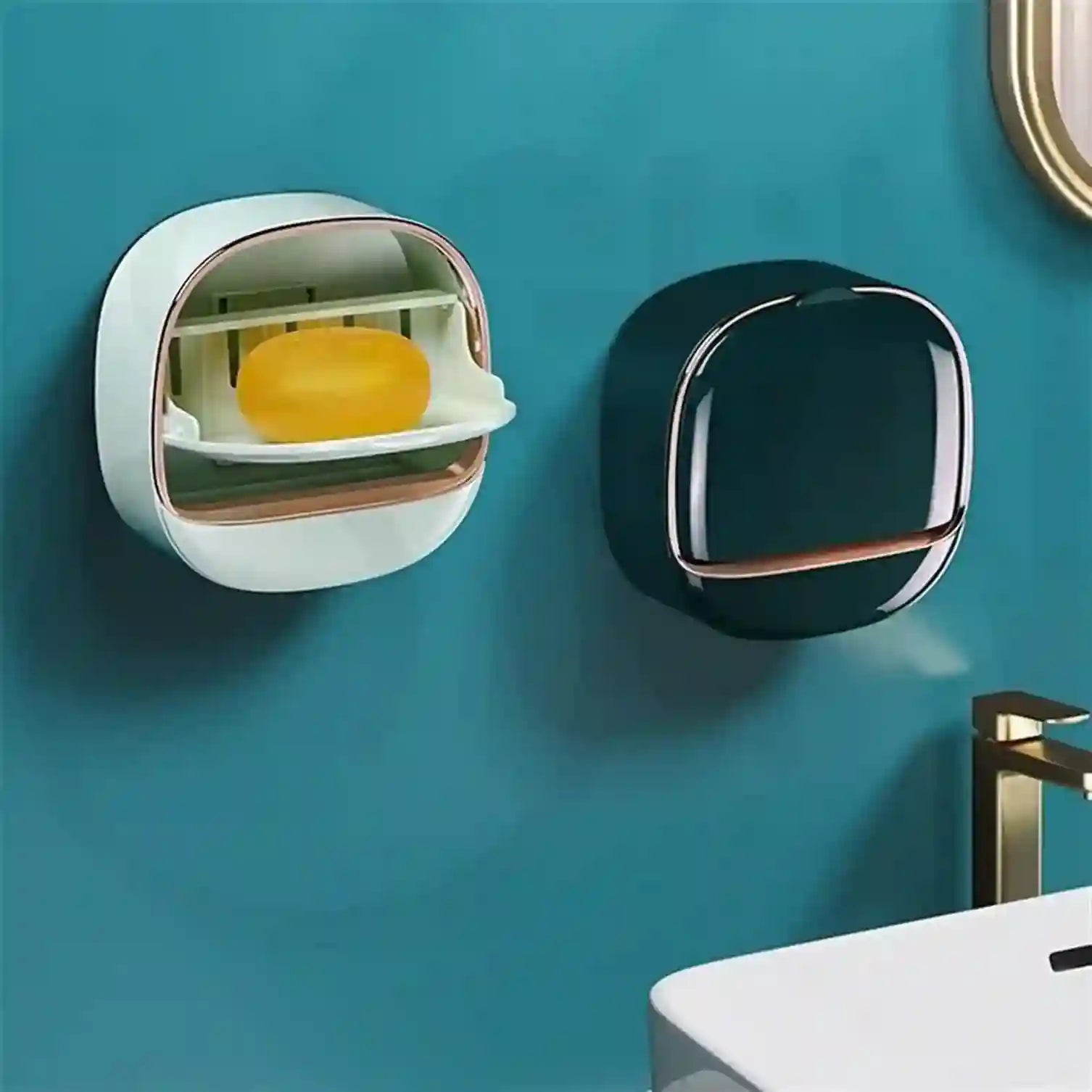 Wall-mounted soap dispensers on a teal wall with a sink partially visible.