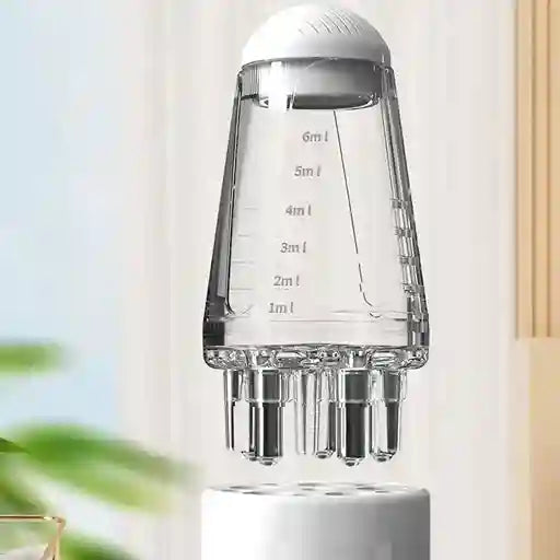 Clear measuring container with white top on a light background