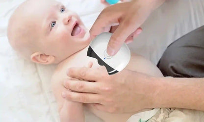 Baby with a diaper being checked by an adult's hand on a white background