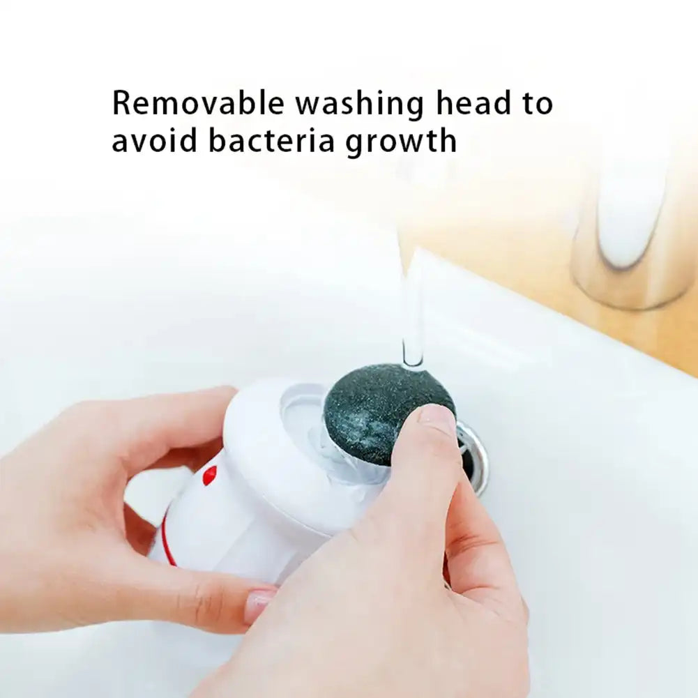 Hand holding a white device with a black cleaning head, text 'Removable washing head to avoid bacteria growth' on a light background.