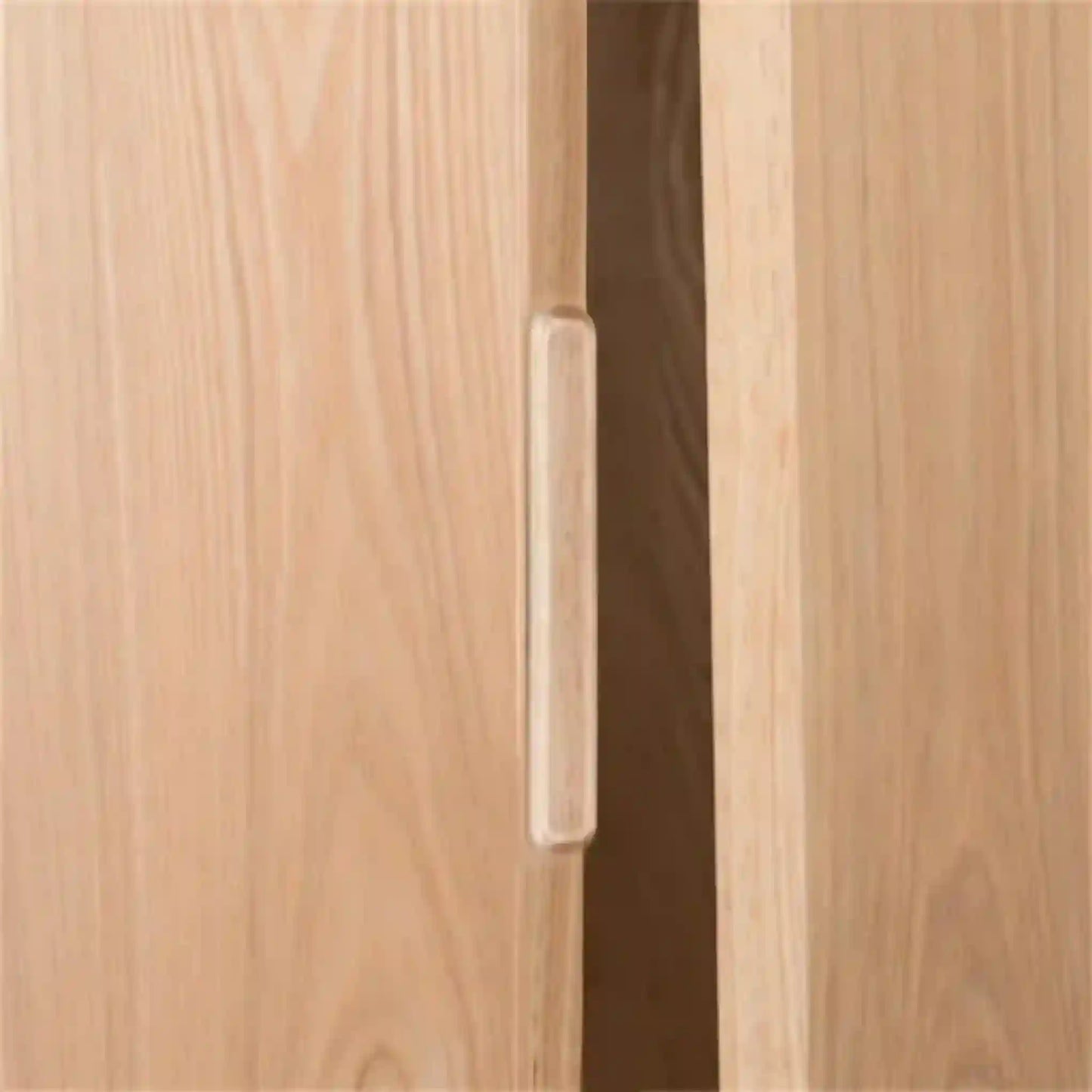 Close-up of a wooden cabinet with a handle