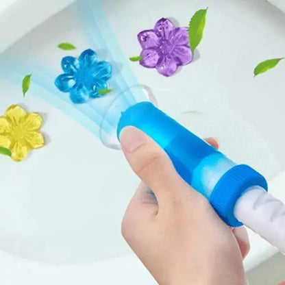 Hand holding a blue water gun with floral nozzles on a white background
