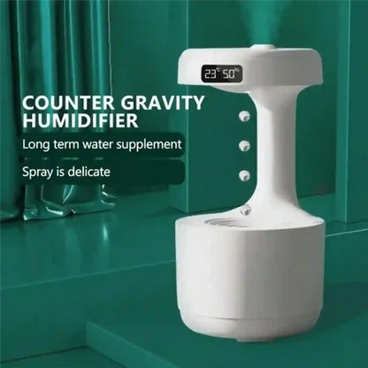 White counter gravity humidifier with digital display on a green background