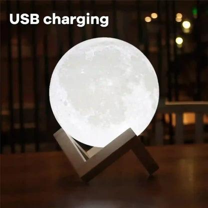 USB charging moon lamp on a wooden stand with a blurred background