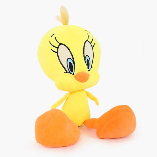Plush toy of a yellow bird with orange feet on a white background
