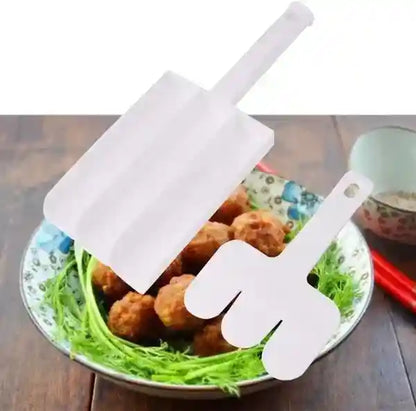 White plastic cutout hands holding a white stick over a bowl of food on a wooden table.