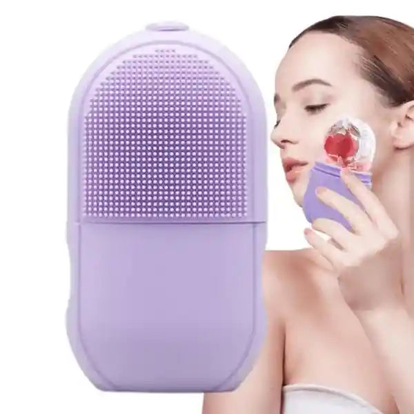 Purple facial cleansing brush held by a person on a white background