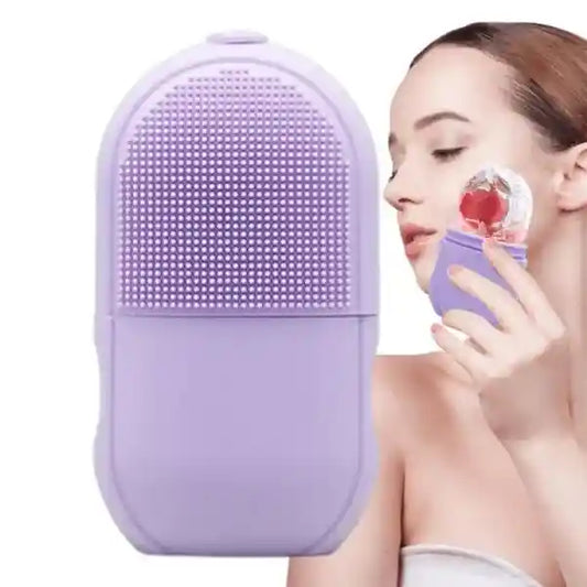 Purple facial cleansing brush held by a person on a white background