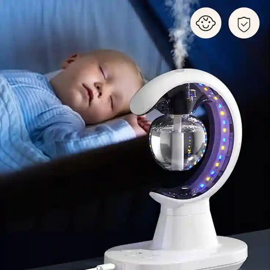 Baby sleeping with a humidifier emitting mist in the background