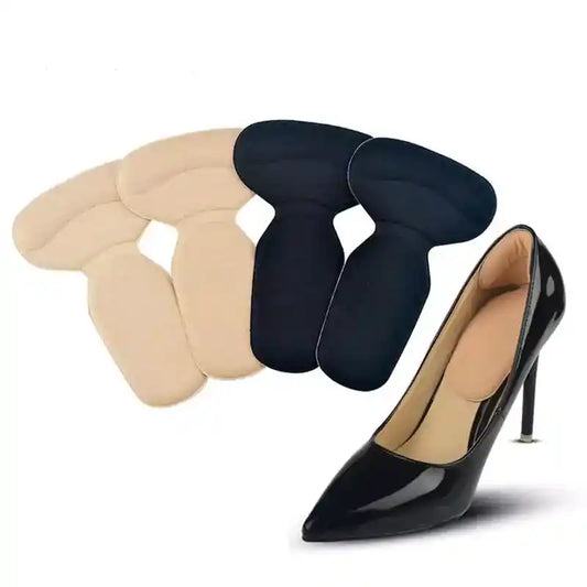 Three pairs of shoe inserts in beige, black, and navy with a black high-heeled shoe.