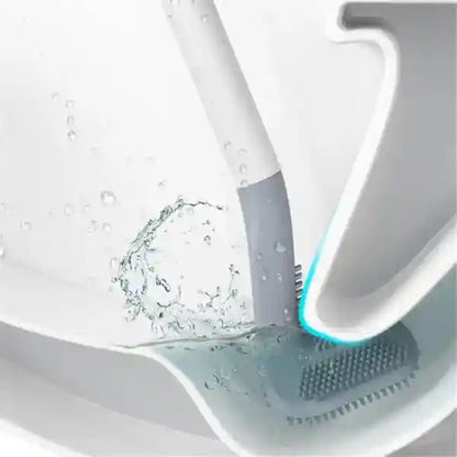 Cleaning brush with water splashes in a sink
