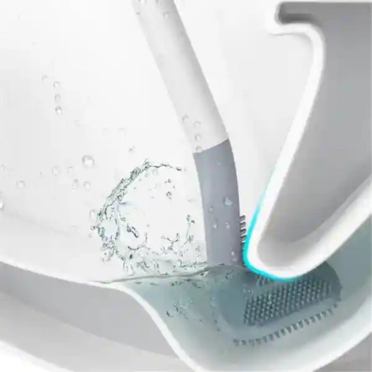 Cleaning brush with water splashes in a sink
