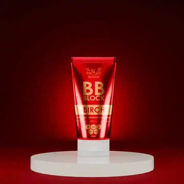 Red BB Block tube on a white stand against a red background