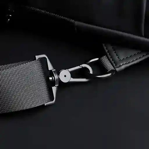 Close-up of a car seat belt buckle on a dark background