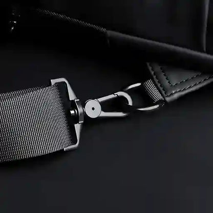 Close-up of a car seat belt buckle on a dark background