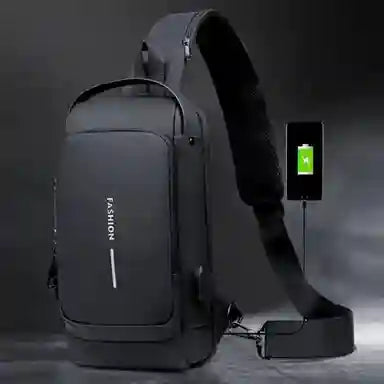 Black crossbody bag with USB charging port on a dark background