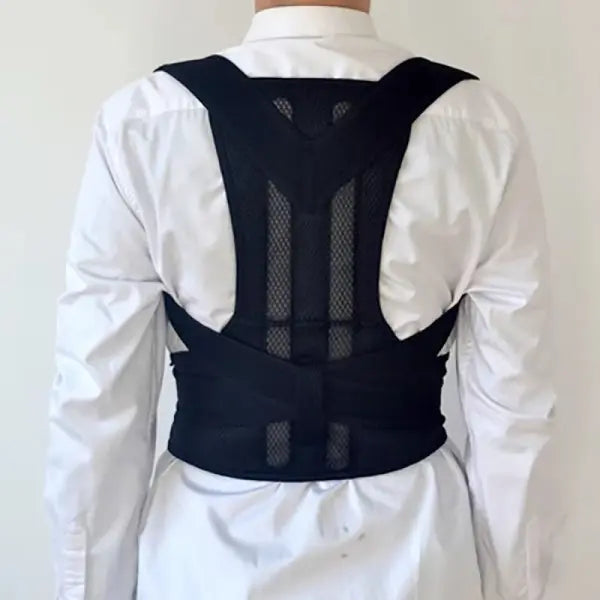 Person wearing a black posture corrector against a white background