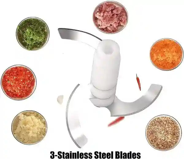 Manual food chopper with various chopped ingredients on a white background